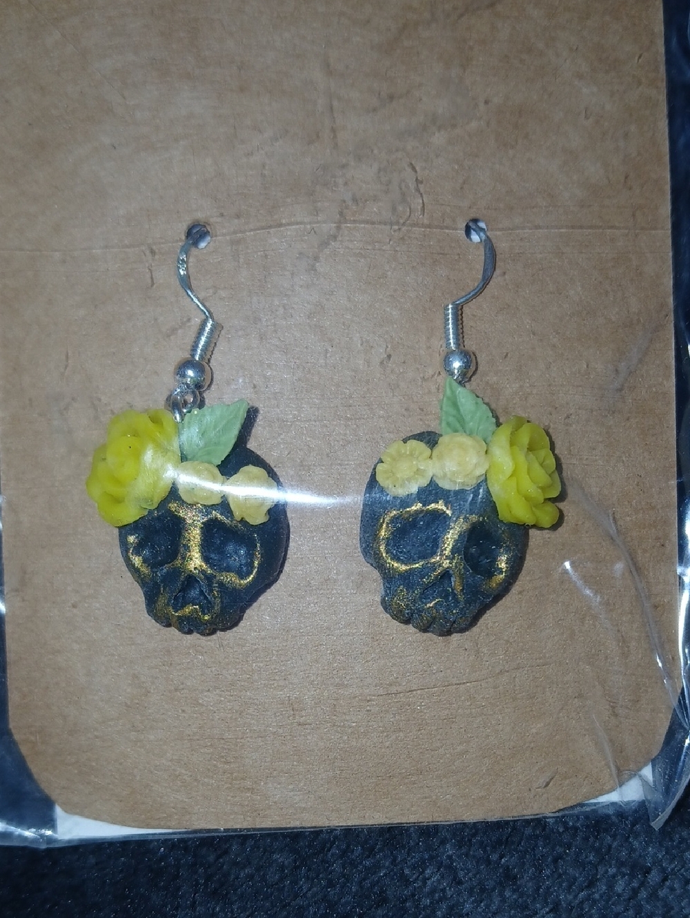 Handcrafted Black Skull Drop Earrings with Yellow Flower Accents